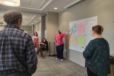 Individual facilitating group discussion 
