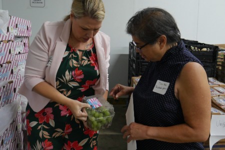 Two people looking at food label