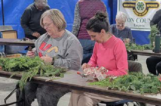 Participants of Grow Your Garden Series making holiday wreaths