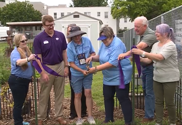 Master gardeners cutting ribbon on new garden in Shawnee County