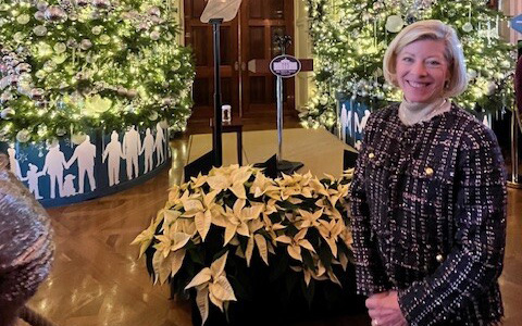 Wendy standing with White House decor