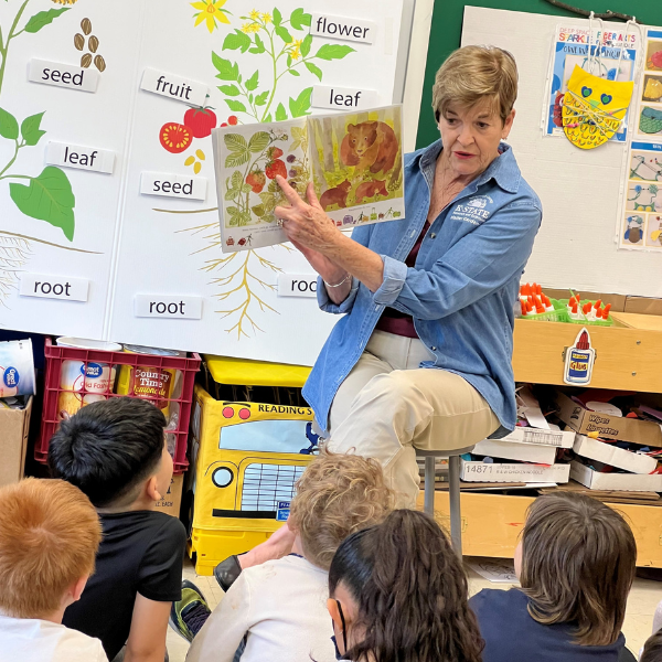 EMG Volunteer Reading to Youth