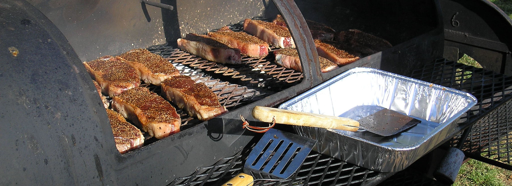 Steaks sitting on grill.