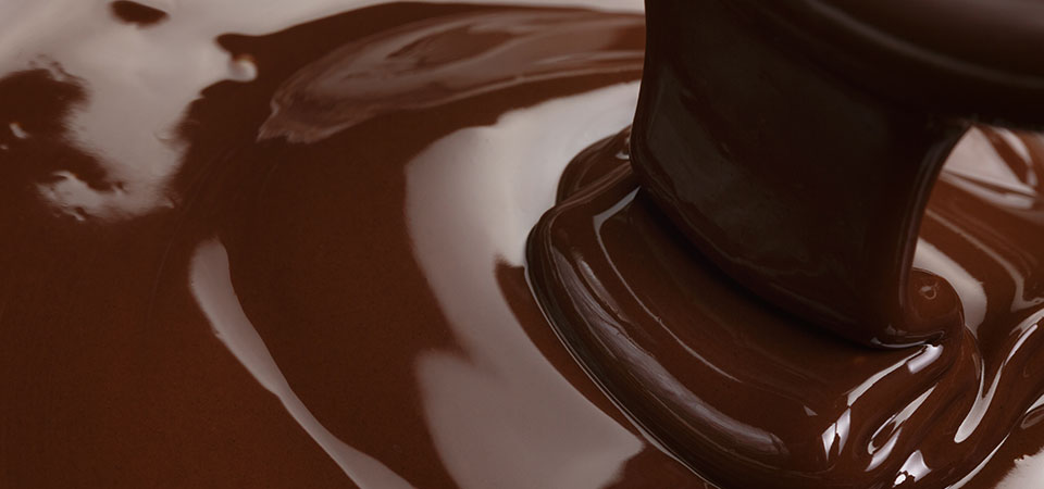Closeup image of chocolate sauce being poured