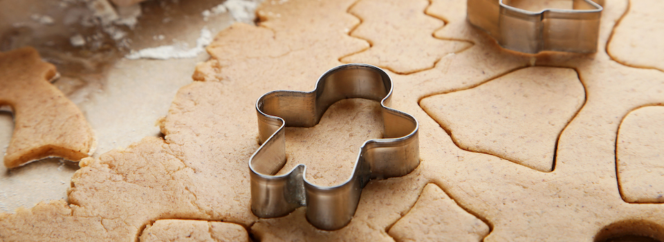 Cookie dough and cookie cutters.