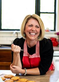 Chuckie Hessong, leaning against counter and laughing