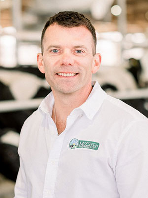 Man in white shirt, smiling at camera