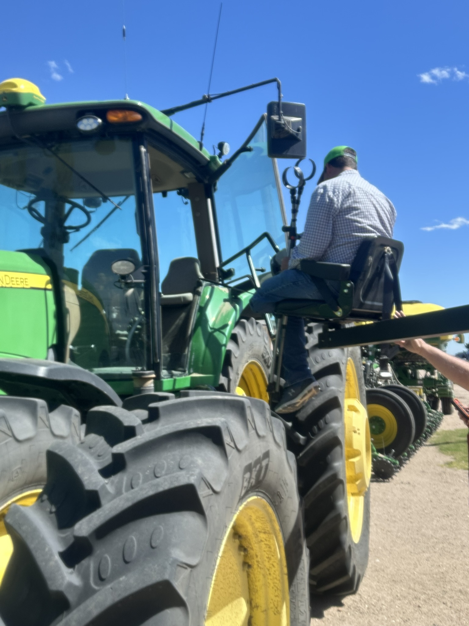 Man safely getting on tractor